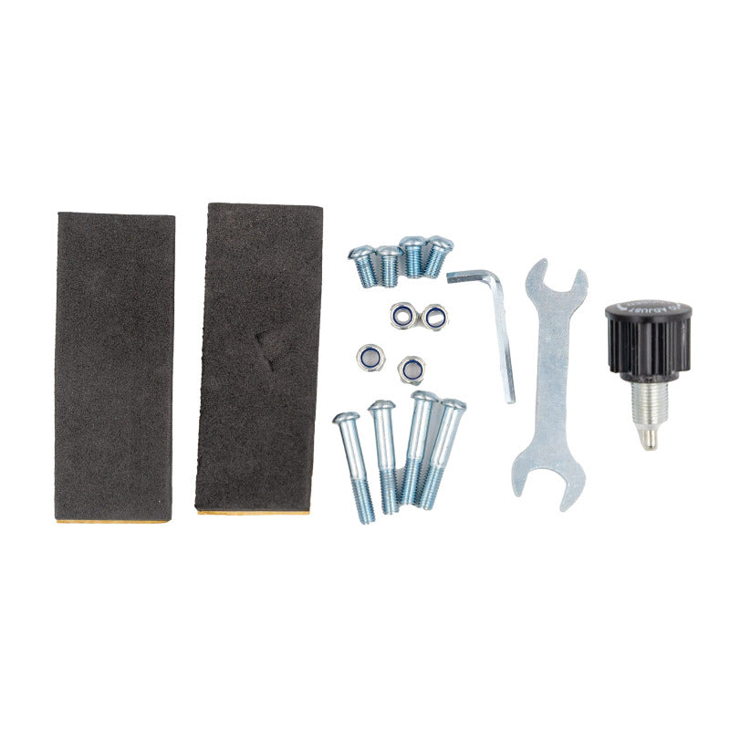 Hoverkart assembly kit featuring two black foam pads, assorted screws and nuts, a hex key, a wrench, and a black adjustment knob 
